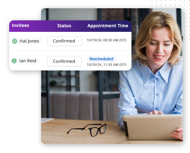 A woman smiles while using a tablet at her desk, tracking invitees on the best CRM platform. An overlay shows Hal Jones and Ian Reid confirmed; Ian Reid’s appointment is rescheduled to 10/20/24, 11:30 AM.
