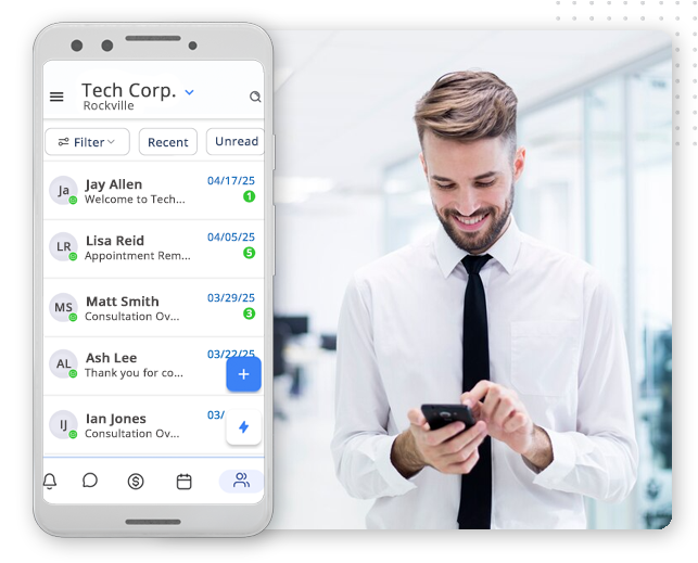 A smartphone screen shows a CRM Software for Small Businesses app with chat messages listed. Next to it, a smiling man in a white shirt and tie stands in an office, looking at his phone.