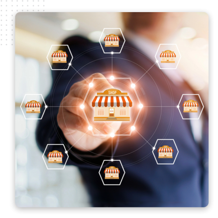 A person in a business suit touches a virtual shop icon, surrounded by interconnected shops, representing a network or franchise concept—ideal for showcasing the reach of an automation company or the power of the best CRM software.