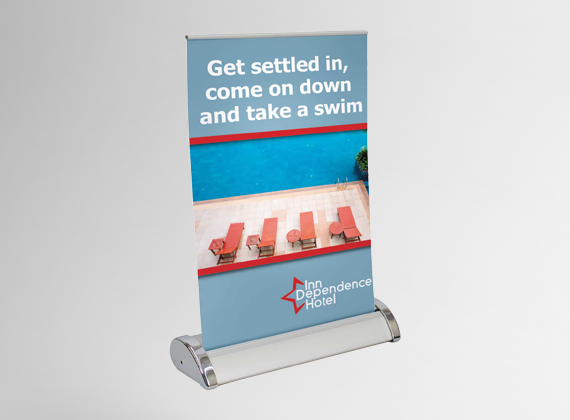 A hotel banner with a poolside photo showing red lounge chairs and umbrellas. Text reads: Get settled in, come on down and take a swim. The bottom displays the Inn Dependence Hotel logo.
